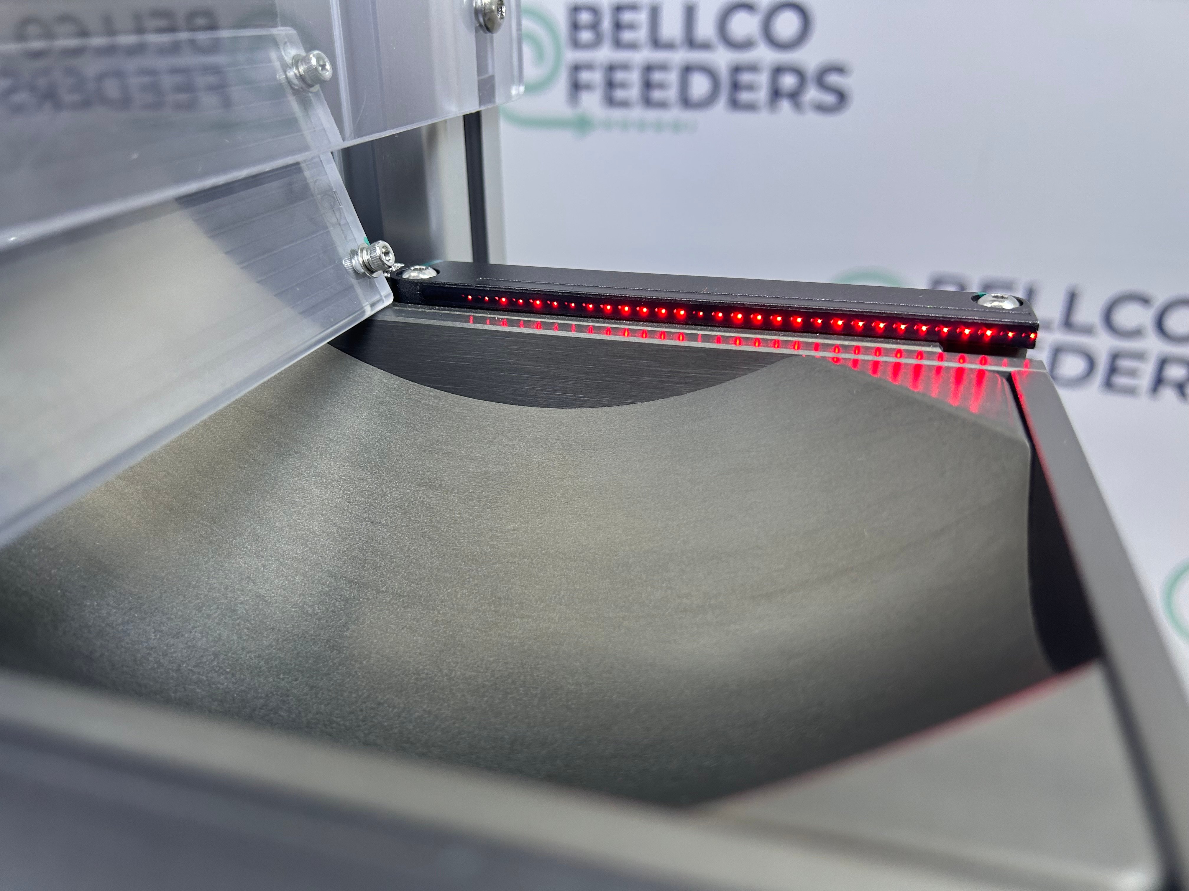 sensor across escapement ensuring parts are not released until the previous group is picked