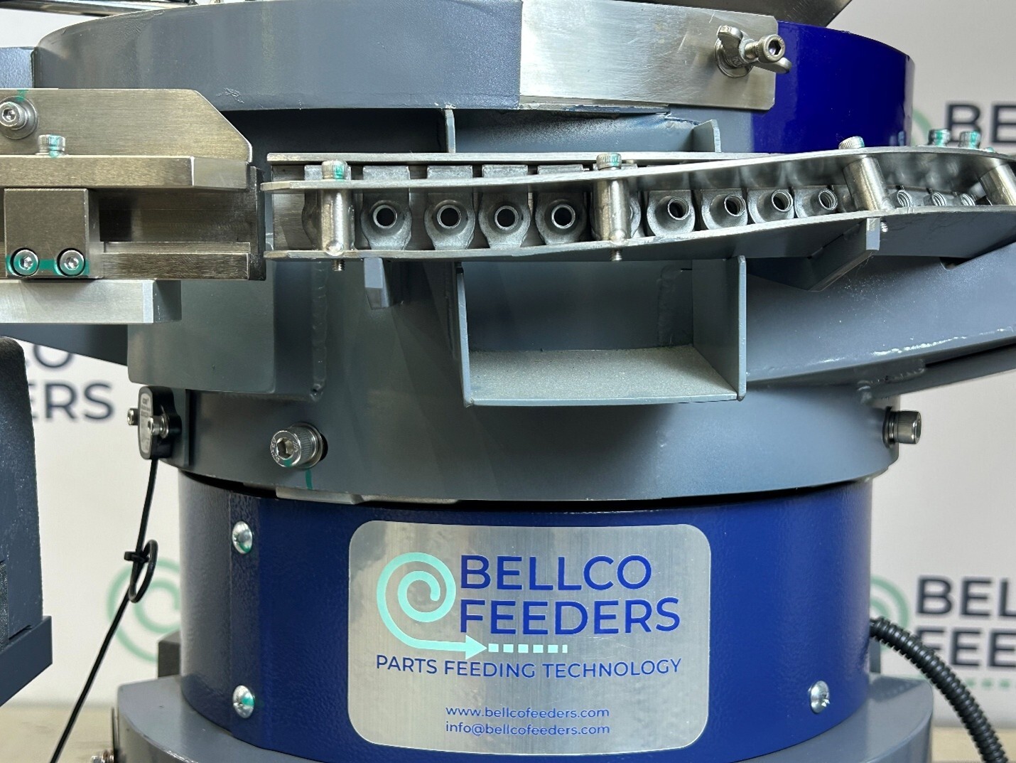 automotive u clips along a track in a Bellco parts feeding system automotive u clips along a track in a Bellco parts feeding system