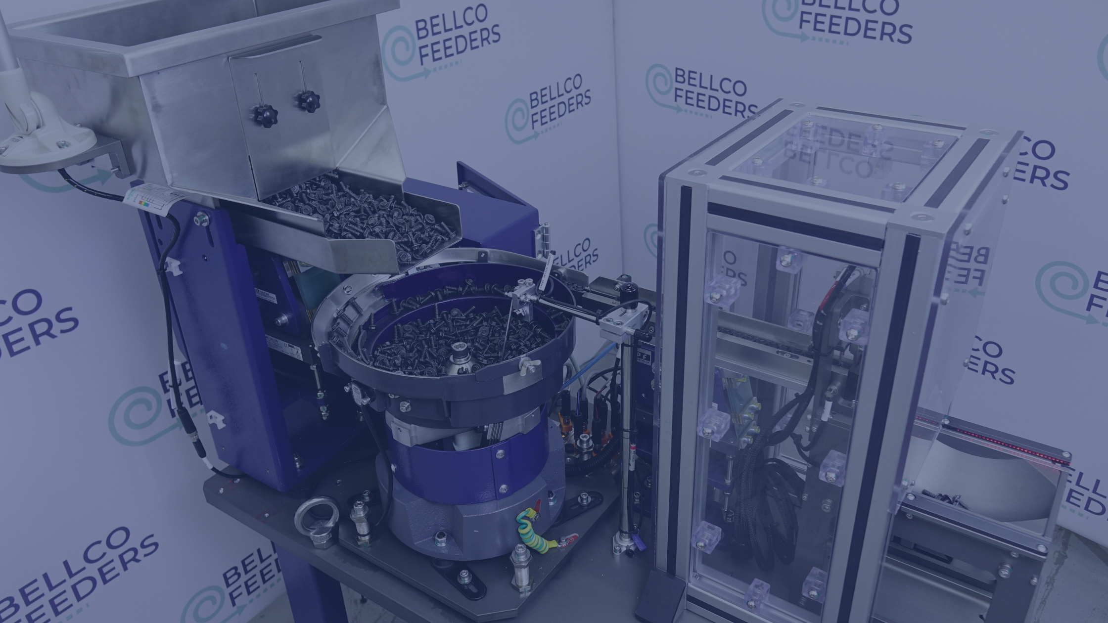 Vibratory bowl feeder from the current case study shown filled with fasteners and with a sound enclosure