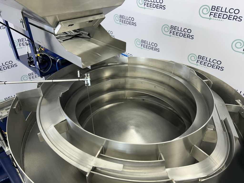 Custom tooling inside an 1100mm Bellco stainless bowl, machined to orient directional metal parts