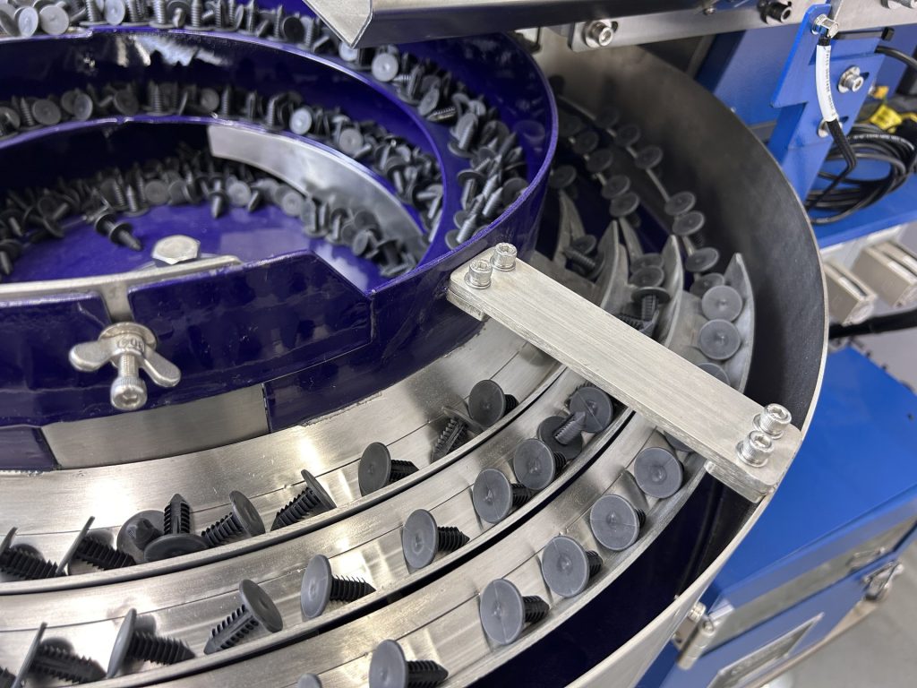 Black fasteners riding the tooled track of a purple polyurethane-coated Bellco bowl