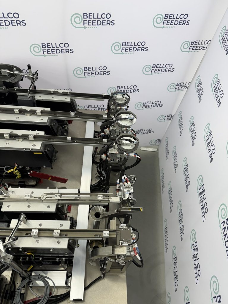 Outfeed side of a five-feeder Bellco cell, with a rotary escapement at the end of each track