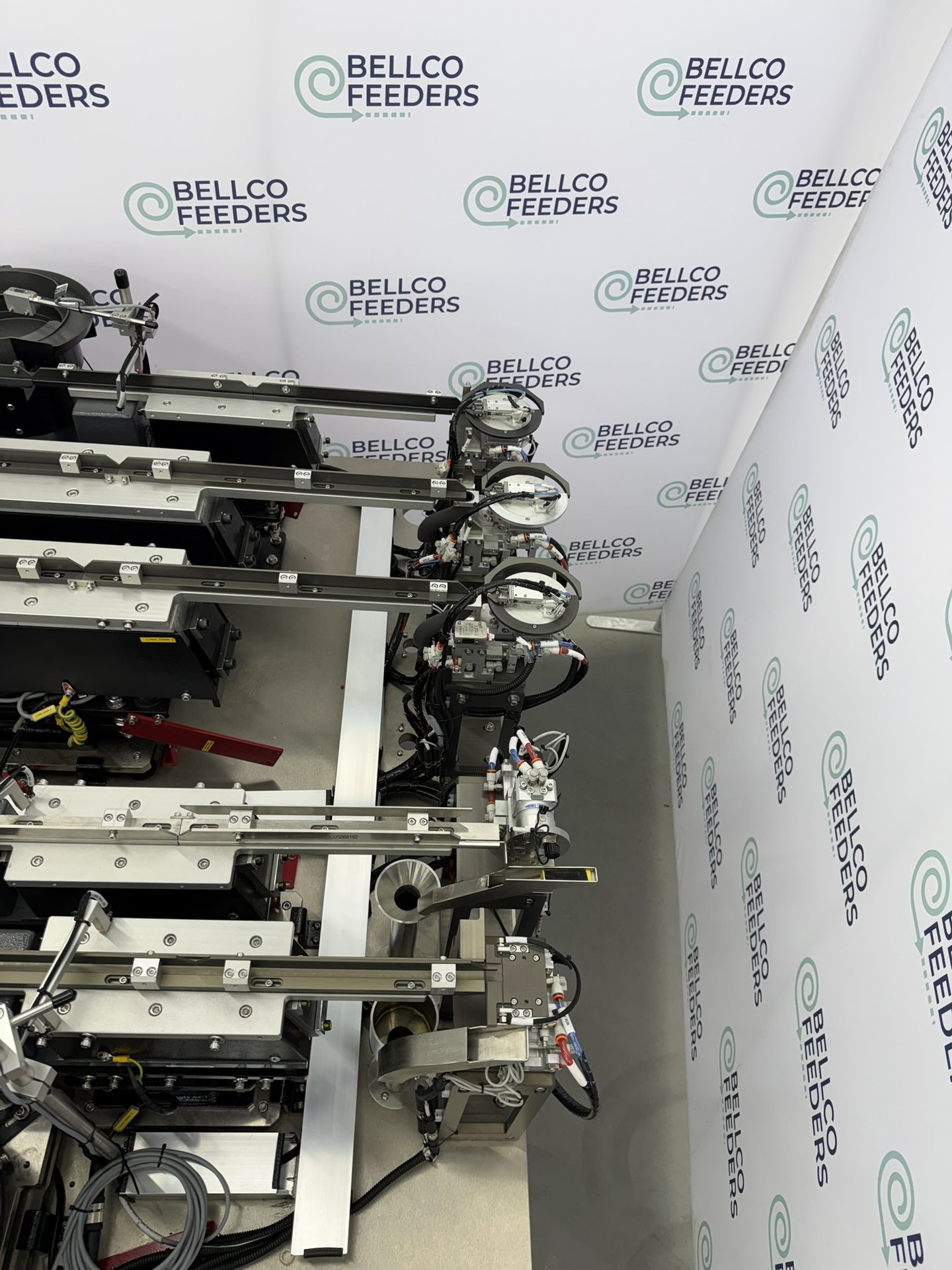Outfeed side of a five-feeder Bellco cell, with a rotary escapement at the end of each track
