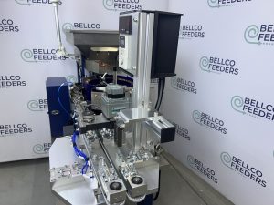 Paste-dispenser mounting bracket above a Bellco conveyor, adjustable up, down, left, right and in rotation