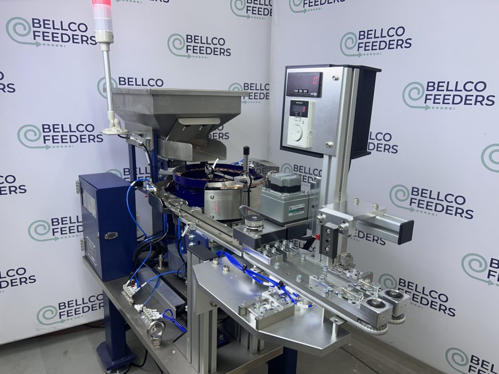 Bellco vibratory bowl and conveyor system with its lockable control enclosure and CUH digital controllers