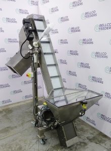 Bellco elevated conveyor hopper on casters, with a stainless bulk bin and an inclined cleated belt