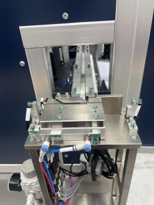 Bellco side shuttle escapement, which spaces parts apart so a robot can pick two at a time