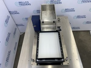 Angled view of a Bellco Flex feeder mounted on a machine base plate