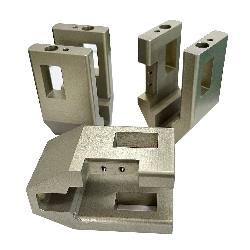 Machined aluminum brackets and housings with an anodized finish