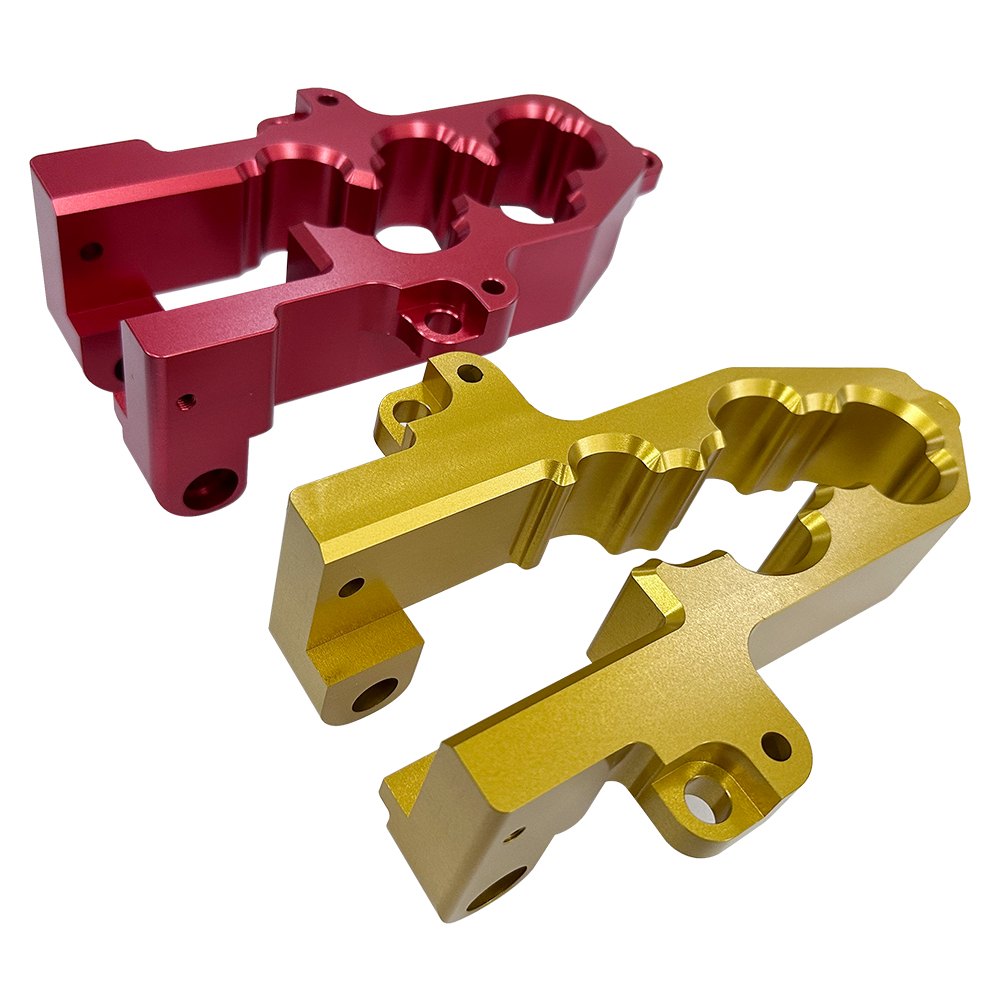 Red and gold anodized machined aluminum manifold blocks