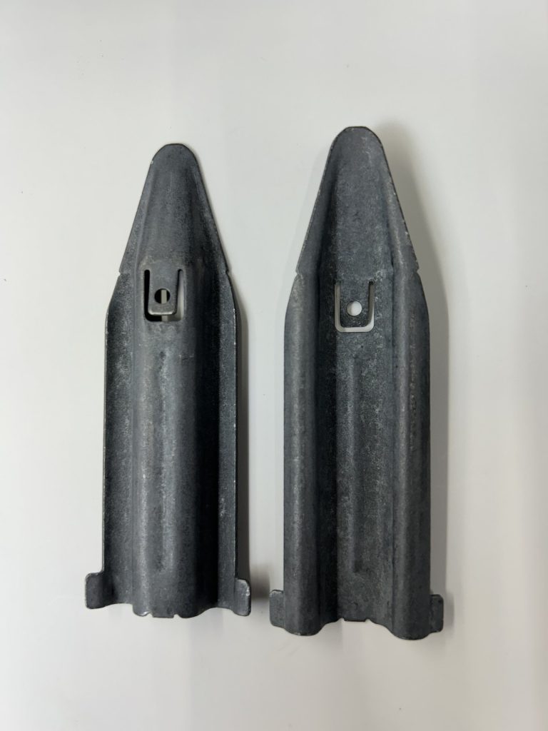 Two directional machined metal components of the kind Bellco tools its bowls to orient