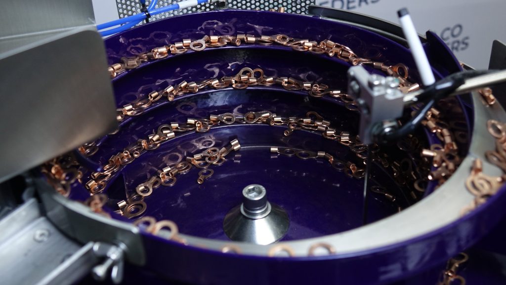 Copper ring terminals traveling barrel-trailing around a 500mm polyurethane-coated Bellco bowl