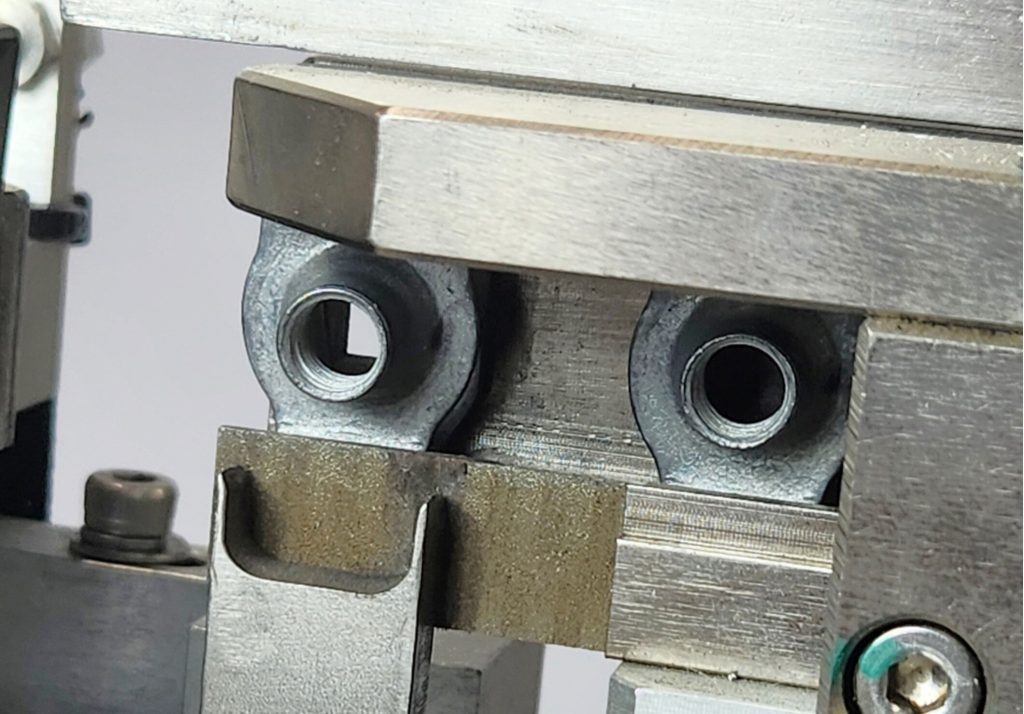 End of linear track before escapement, open