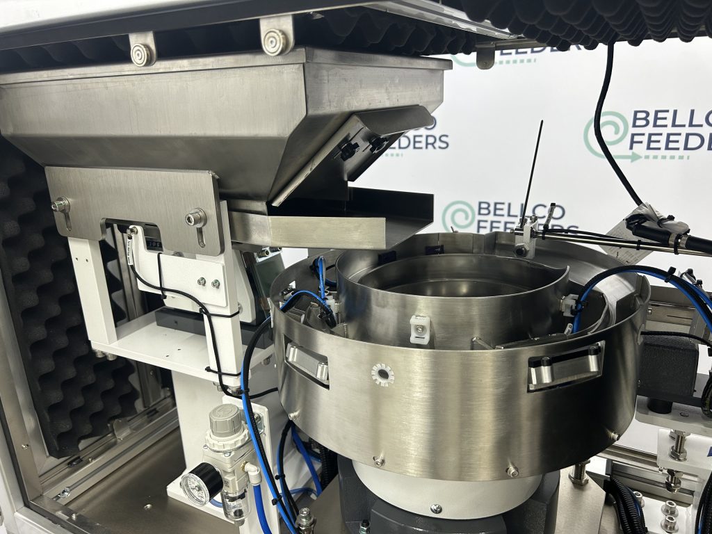side view of Bellco vibratory bowl feeder with bulk parts hopper