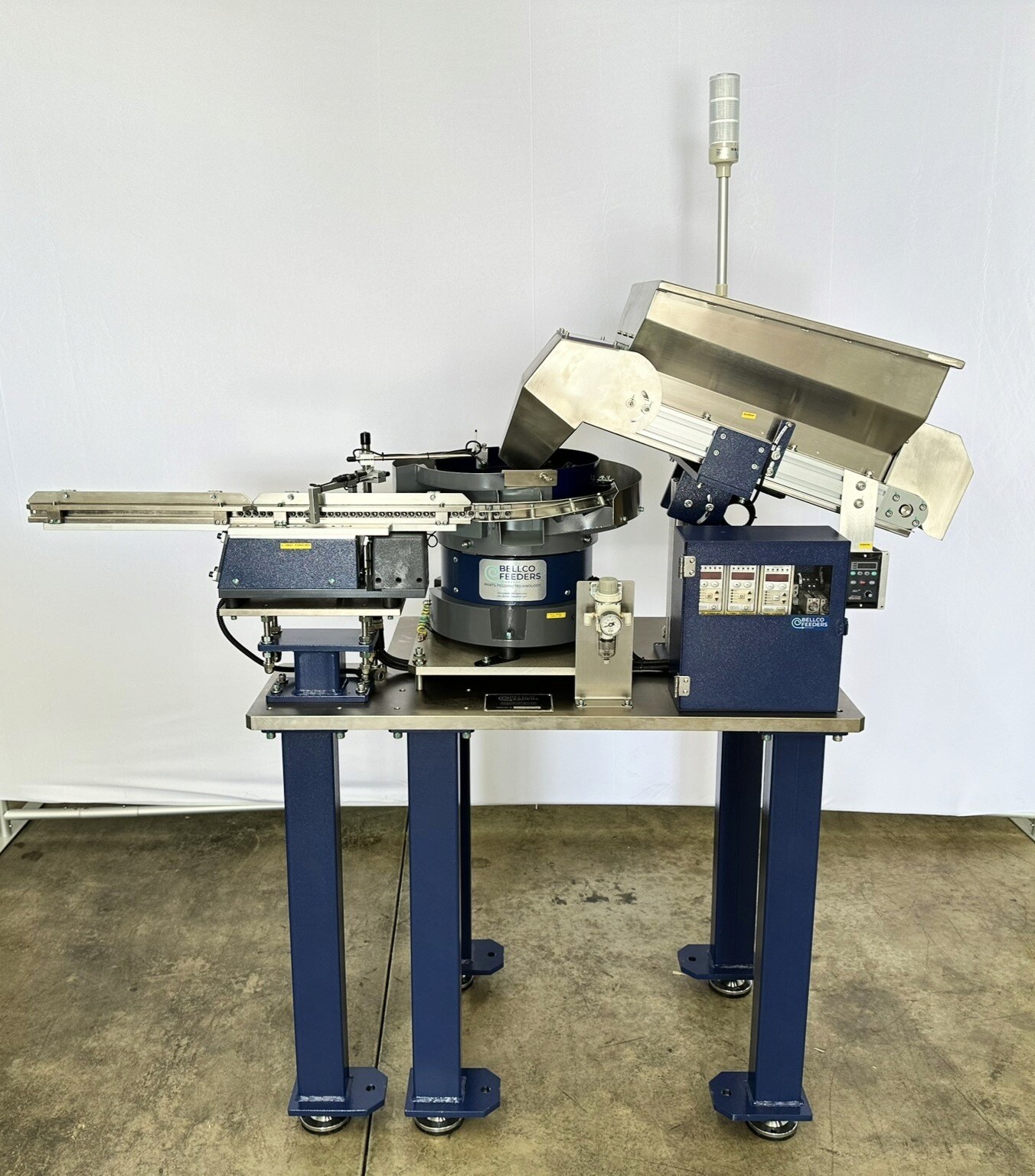 side view image of the entire feeder system including bowl feeder, hopper, and linear track