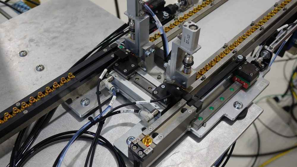 Custom escapement delivering rivets to exact location on the existing press.