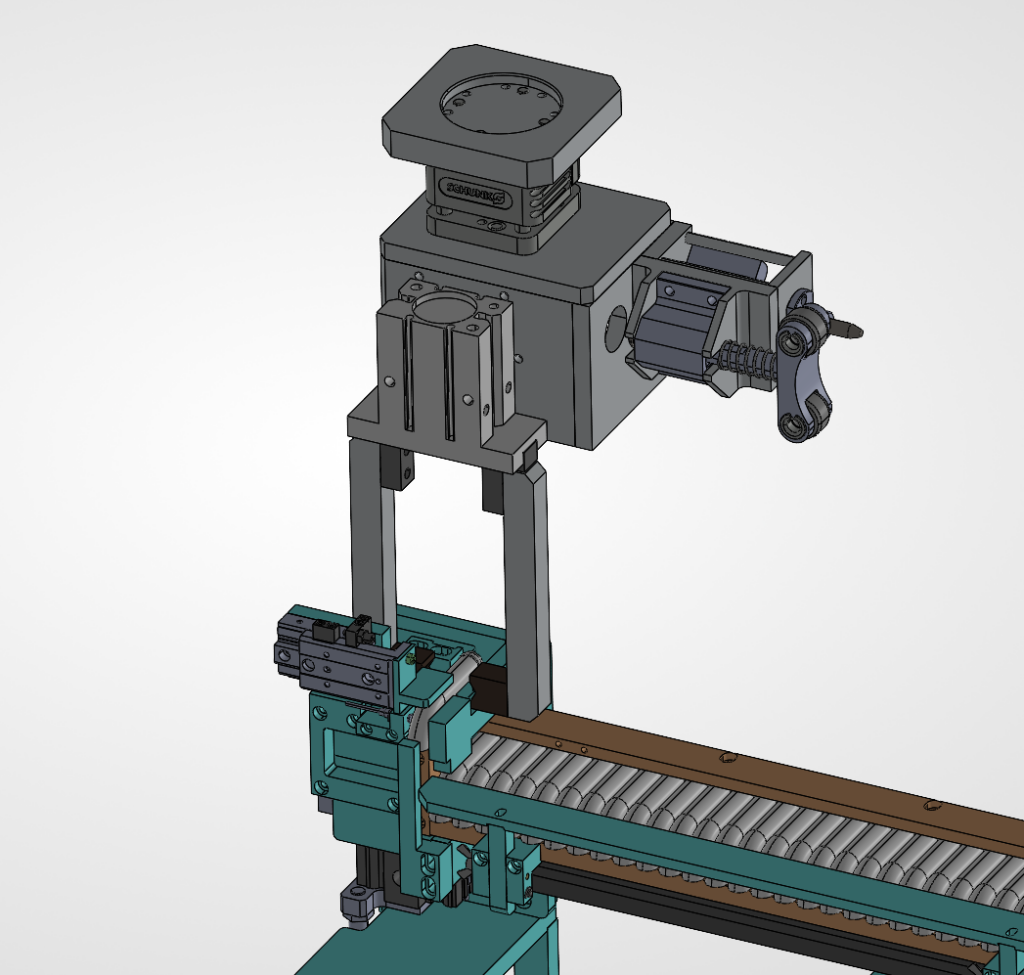 CAD model of a pneumatic escapement and gripper lifting parts from an inline feed track
